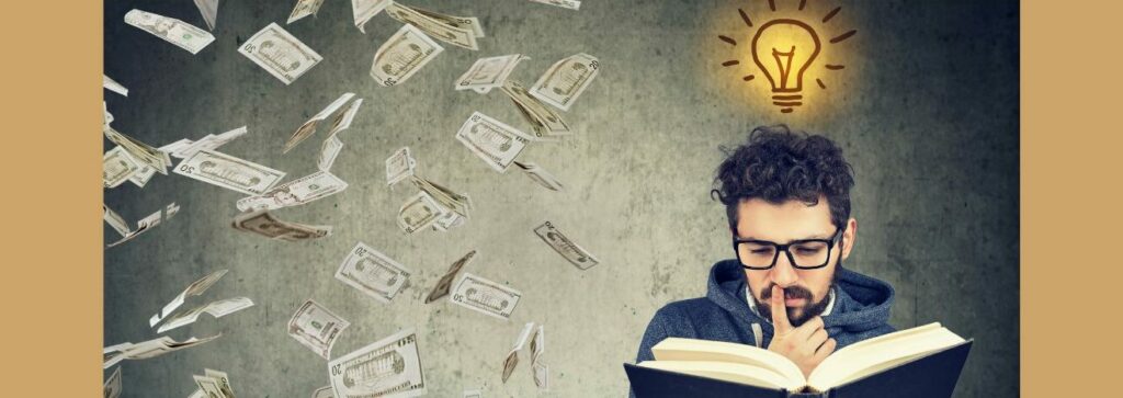 Discover the Secret to Earn as You Learn with Wealthy Affiliate (1).

Tan background. gray, black marbled  square. 

Money floating in the ar....  A yellow light bulb graoh with black slash marks top right 

A white man, curly black hair,  black beard, black glasses, blue sweatshirt, his right hand  raise, pointer finger to his mouth. Holding a thick book open. 