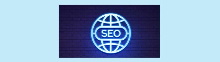 Beginners Guide to International SEO Strategies for Global Reach (3). Light blue background. Brick wall background cast in blue light of a international logo in silver, SEO in silver in the center.