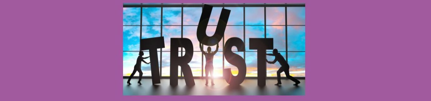 Building Trust With Potential Customers (4).
Purple background, Glass window across, with black frames, sky background, pink, purple and white clouds, blue sky. T R U S T in large stand up black letters. Shadow figure pushing up "T", Shadow figure holding up "U" above head. Shadow figure pushing the "T".