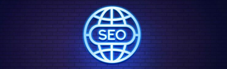 International SEO Strategies for Global Reach Brick wall background cast in blue light of a international logo in silver, SEO in silver in the center.