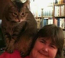 About me picture (1).
A very large brown, black striped cat sitting on my shoulder. 